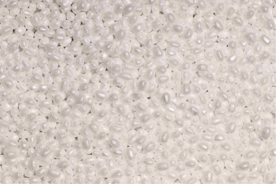 Close-up of white expanded ARPRO foam beads.