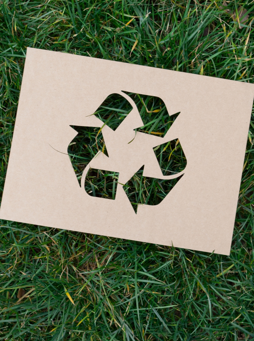 A piece of paper for a recycling loop on grass to show JSP is a closed loop EPP manufacturer